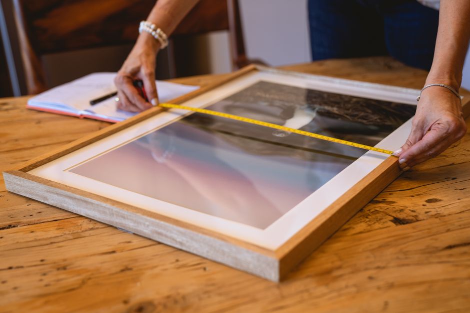 Contractor measuring a custom window frame